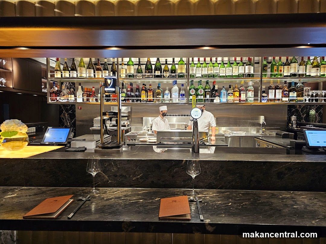 Bar Counter with Drinks and Staff