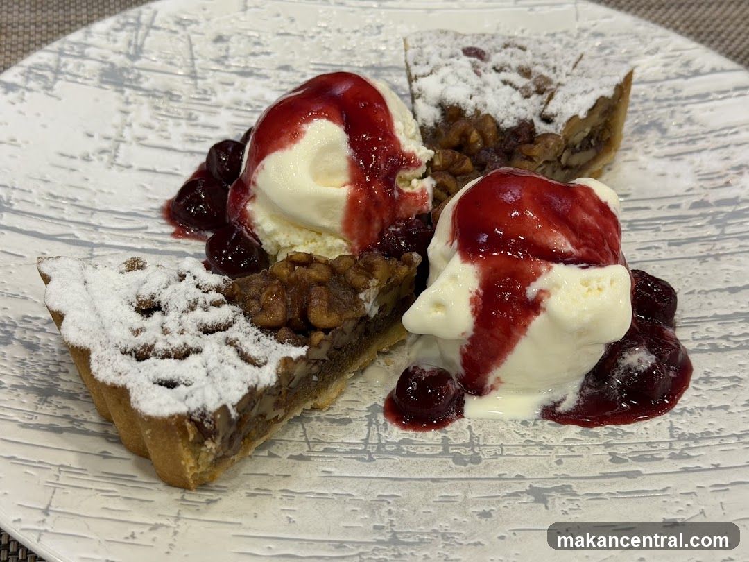 Pecan Pie with Ice Cream and Cherry Sauce