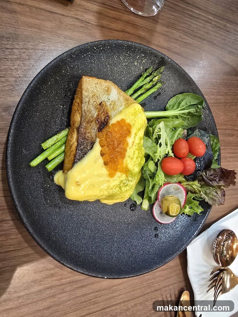 Fish dish with asparagus and salad