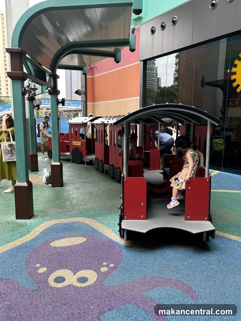 Children on a toy train ride