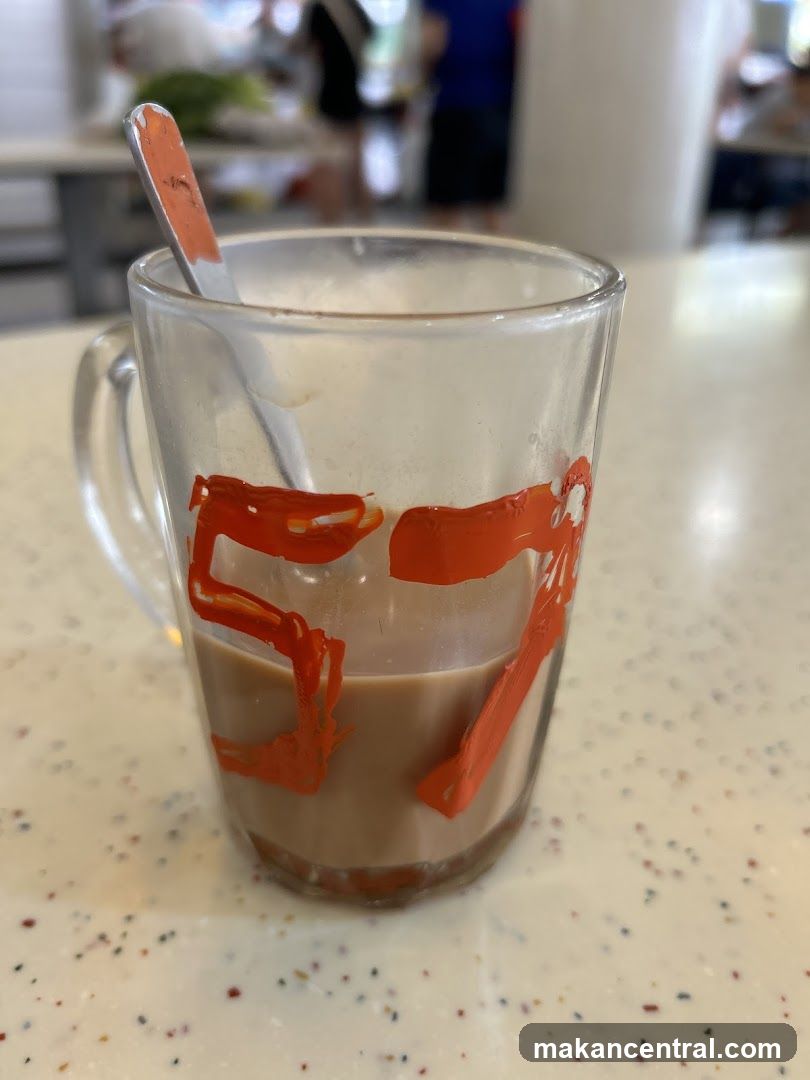 Mug with drink and spoon