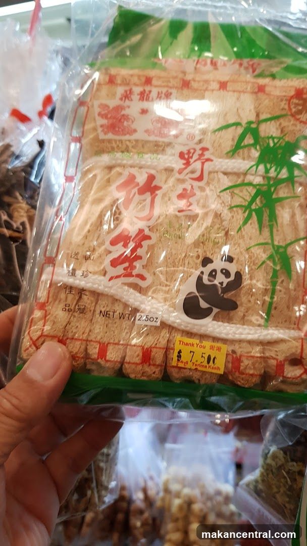 Hand holding packaged bamboo shoots
