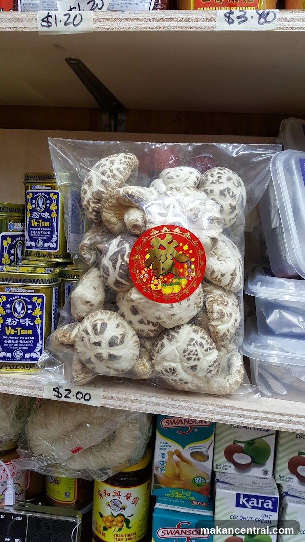 Shelf with dried mushrooms and Asian grocery products
