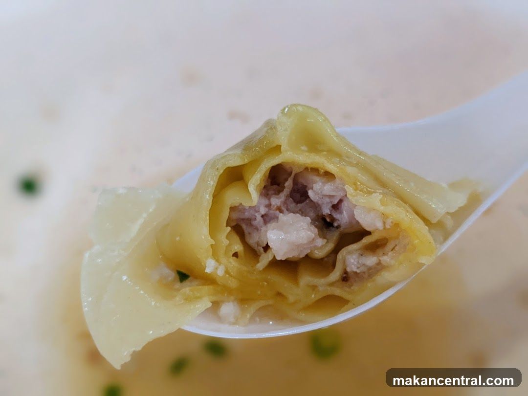 Close-up of a Wonton on a Spoon