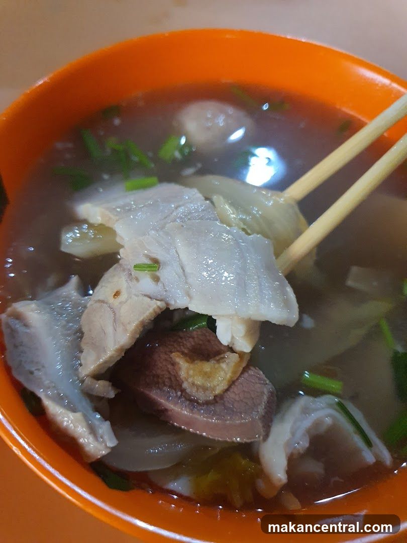 Bowl of Soup with Meat and Vegetables