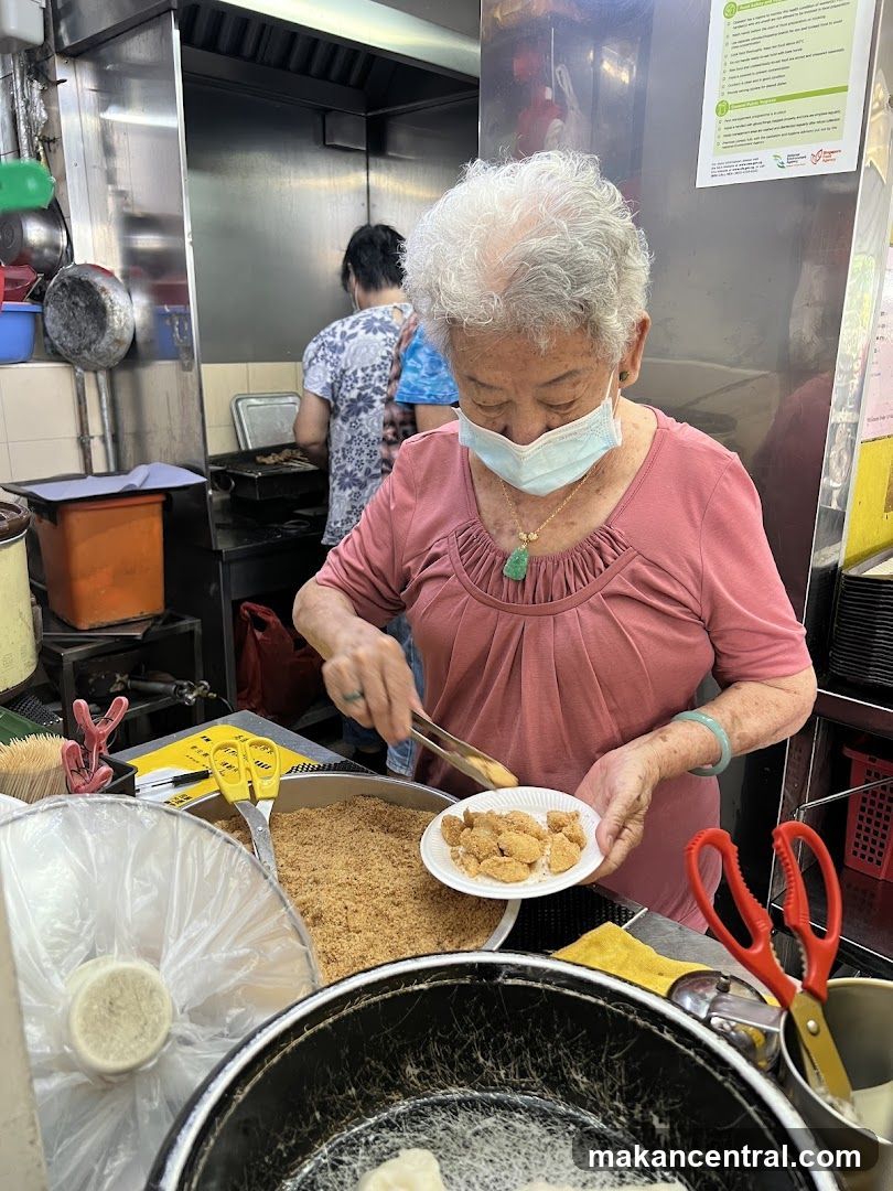 Elderly Woman Preparing Food
