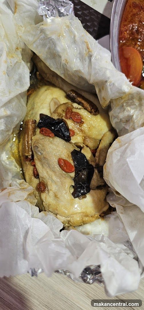 Paper-wrapped chicken with herbs