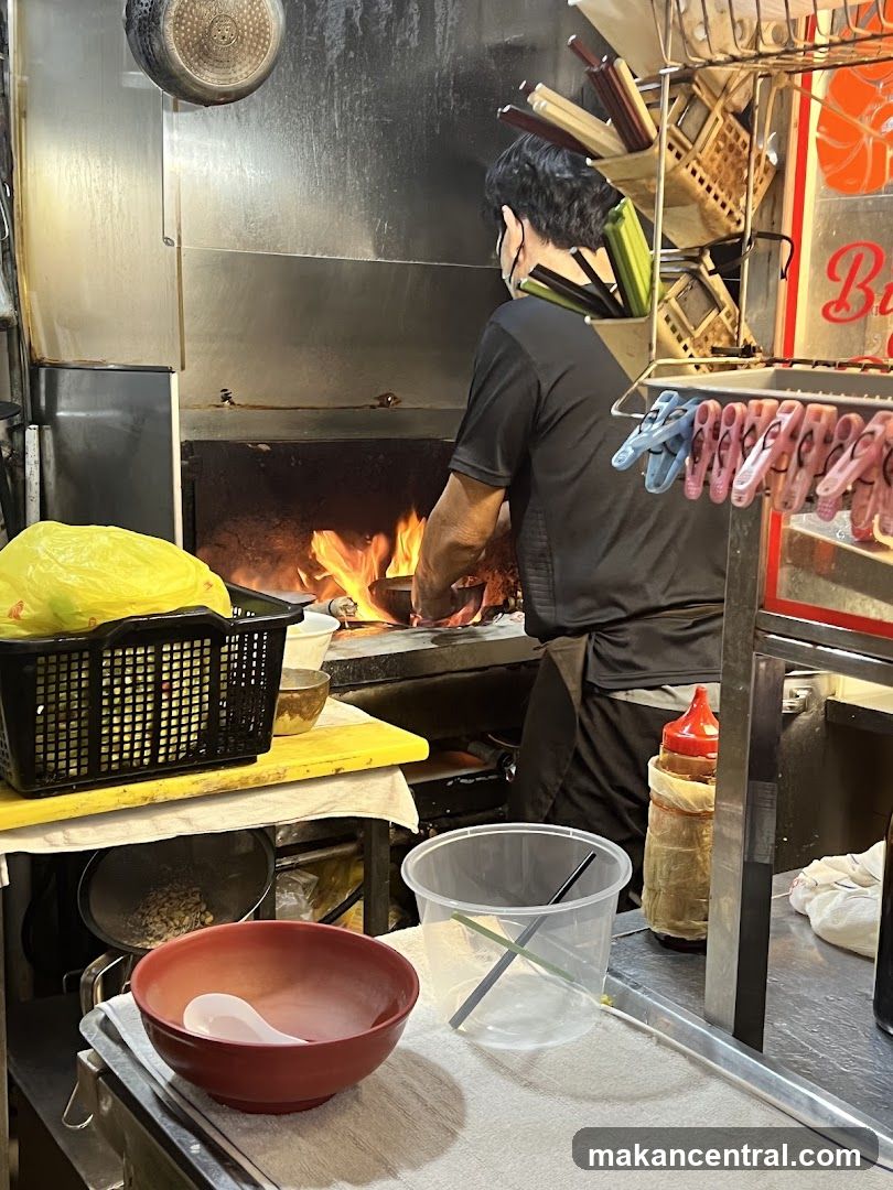 Chef cooking at a wok