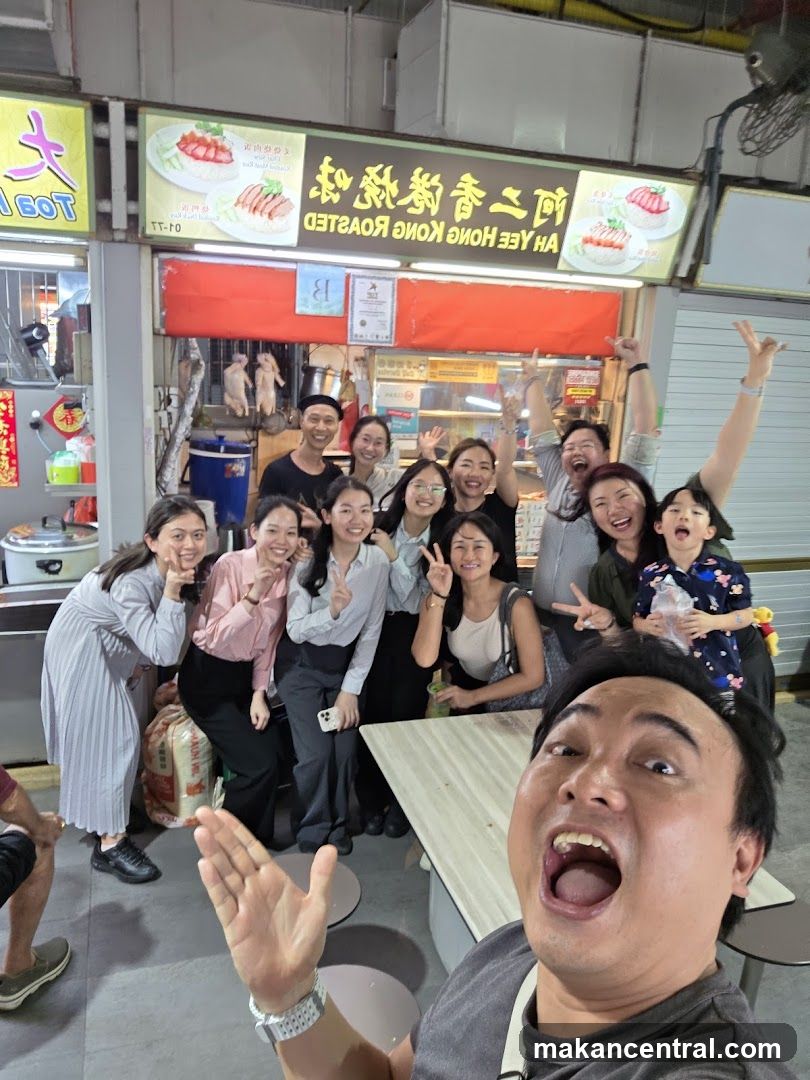 Group posing for a photo at a food stall