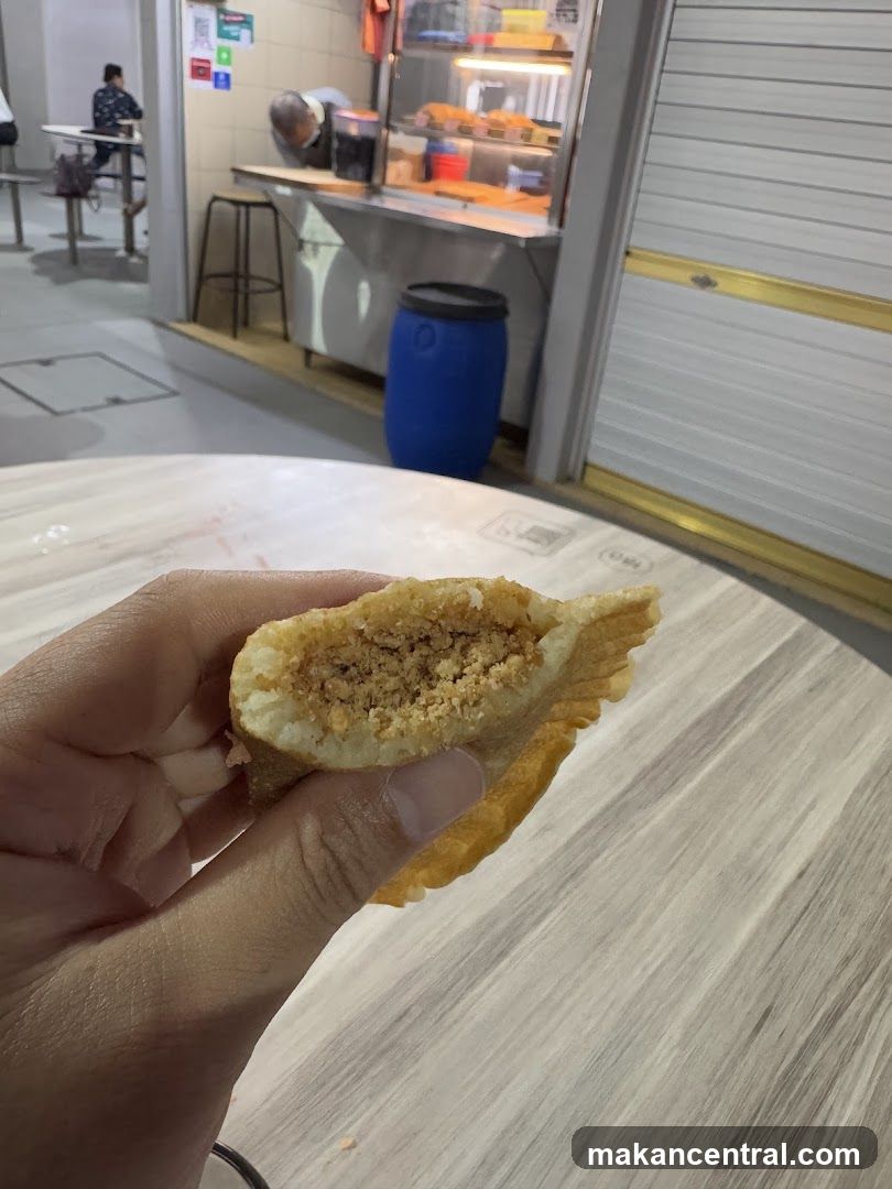 Hand holding a peanut pancake