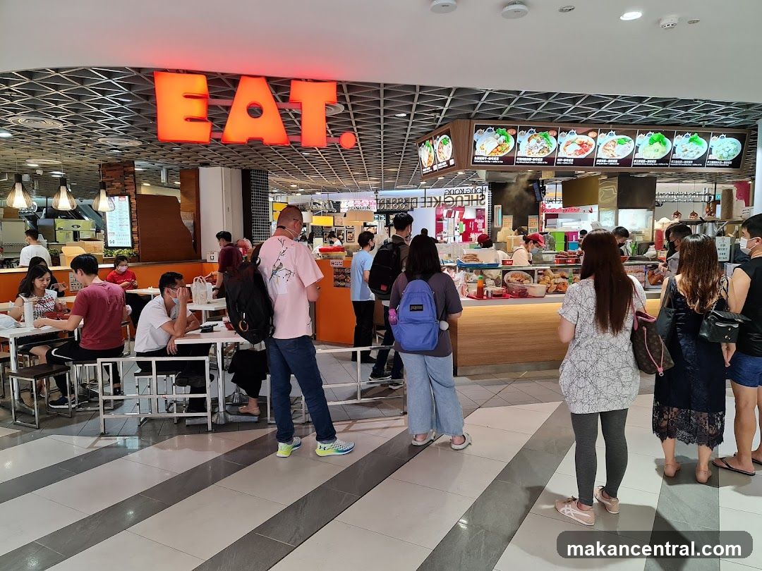 Food court with people dining and ordering