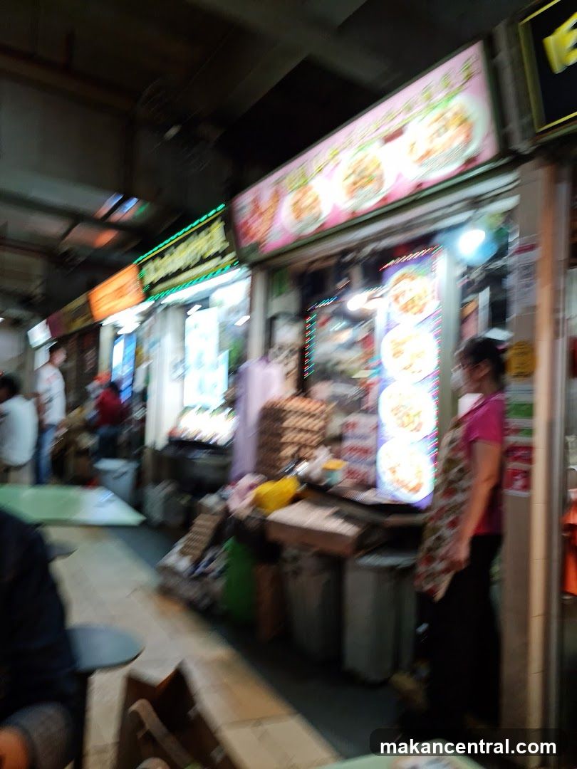 Food stalls with illuminated signs