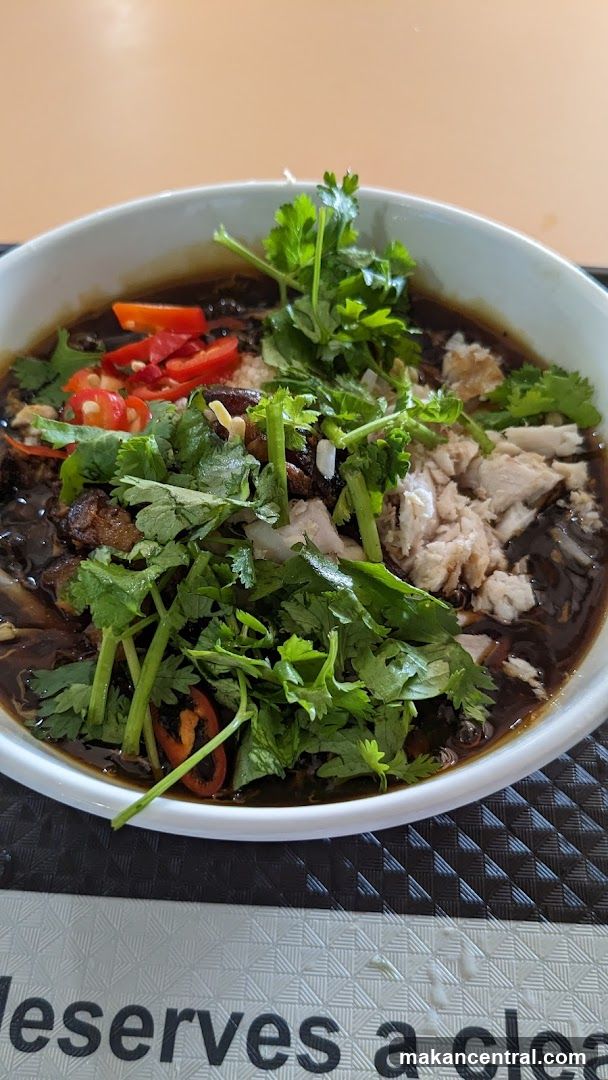 Bowl of noodles with shredded chicken and chili