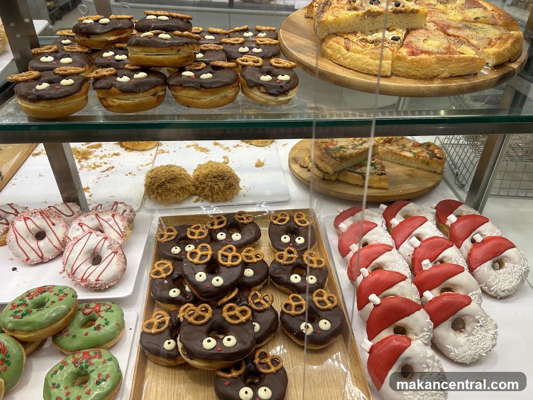 Assortment of Donuts and Pizzas