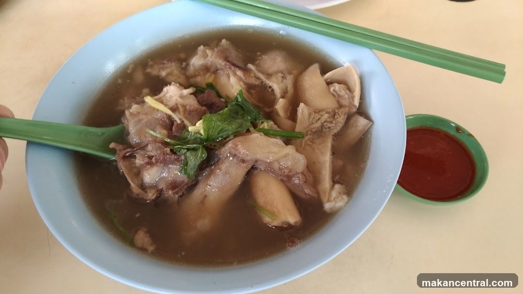 Bowl of Meat Soup with Chili Sauce