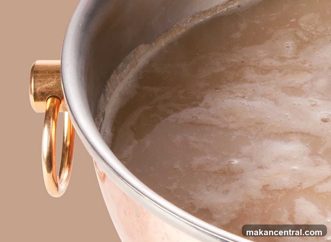 Close-up of a foamy liquid in a pot