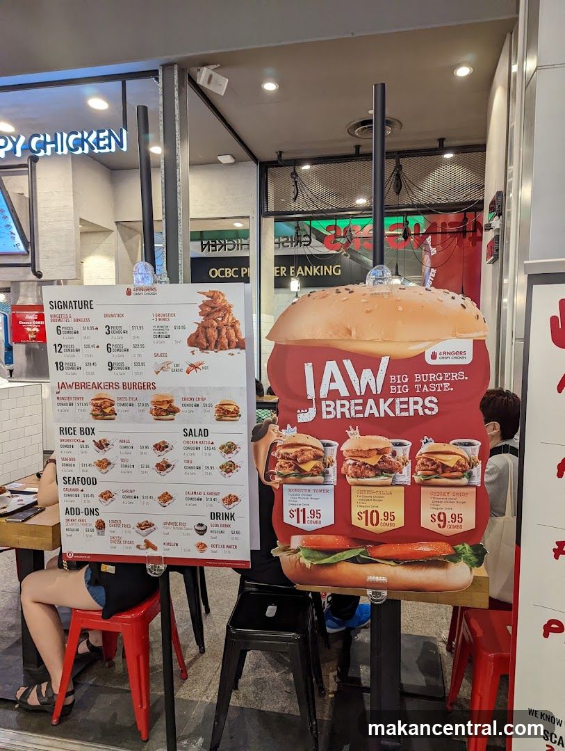 Menu board with burger and chicken offerings