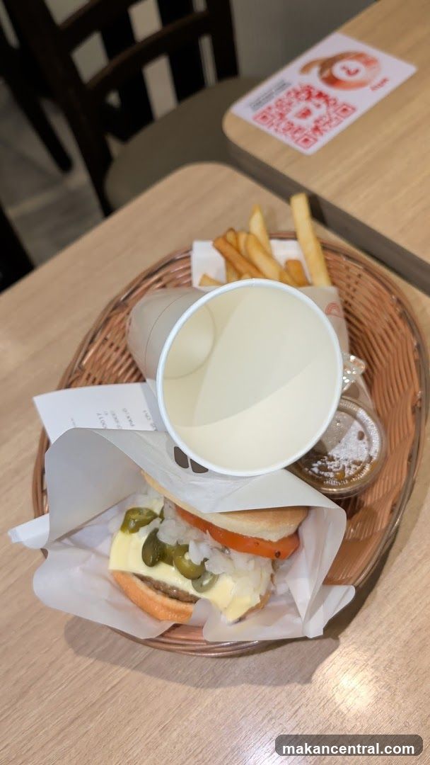 Burger meal with fries and drink cup