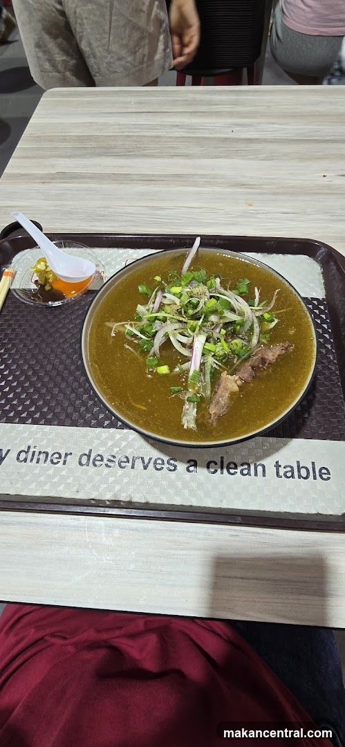 Bowl of soup with meat and vegetables