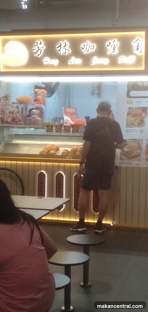 Food stall with pastries and menu