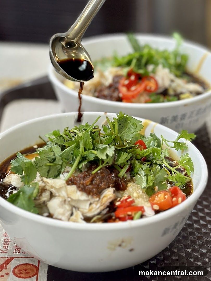 Adding Sauce to a Bowl of Food
