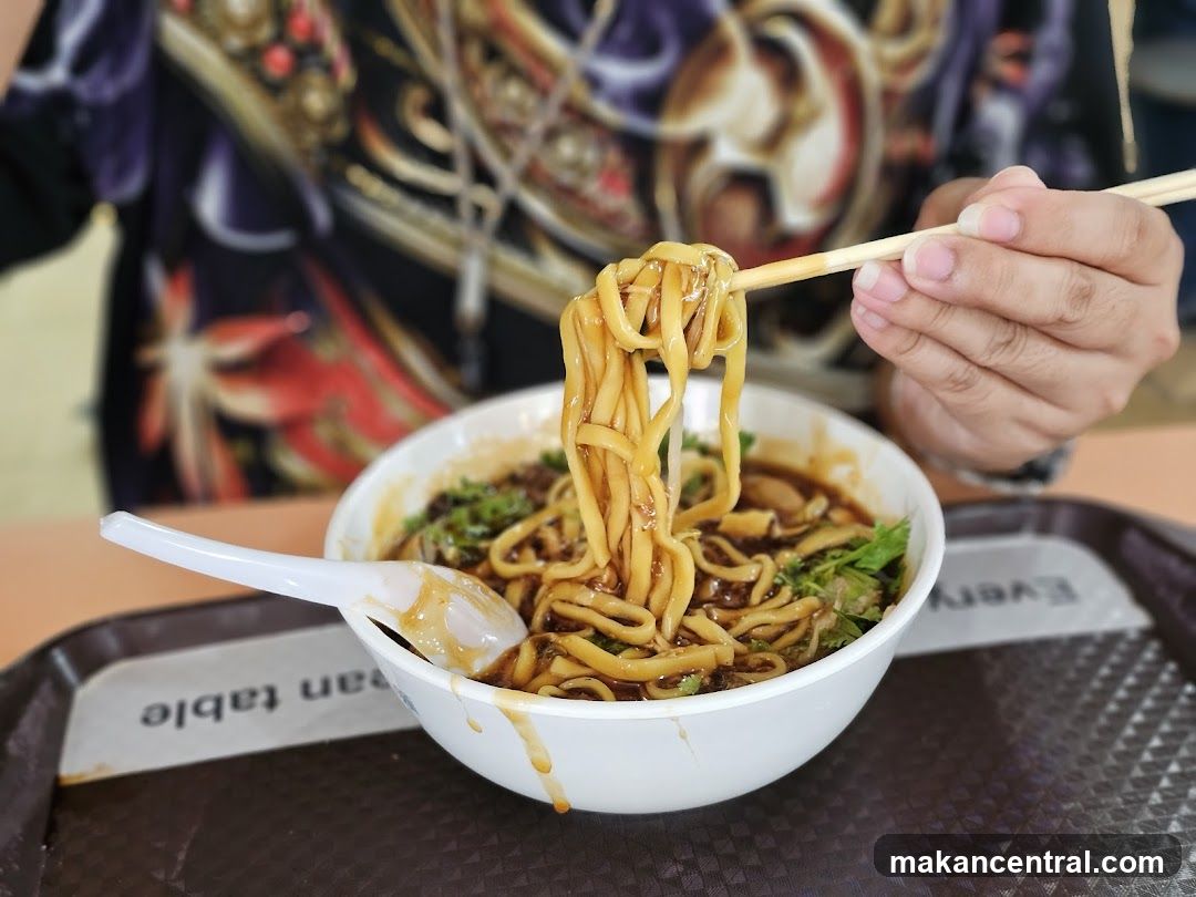 Noodles being lifted with chopsticks