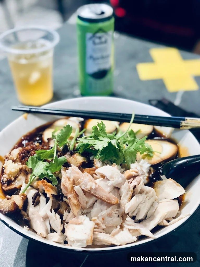 Bowl of noodles with shredded chicken and eggs