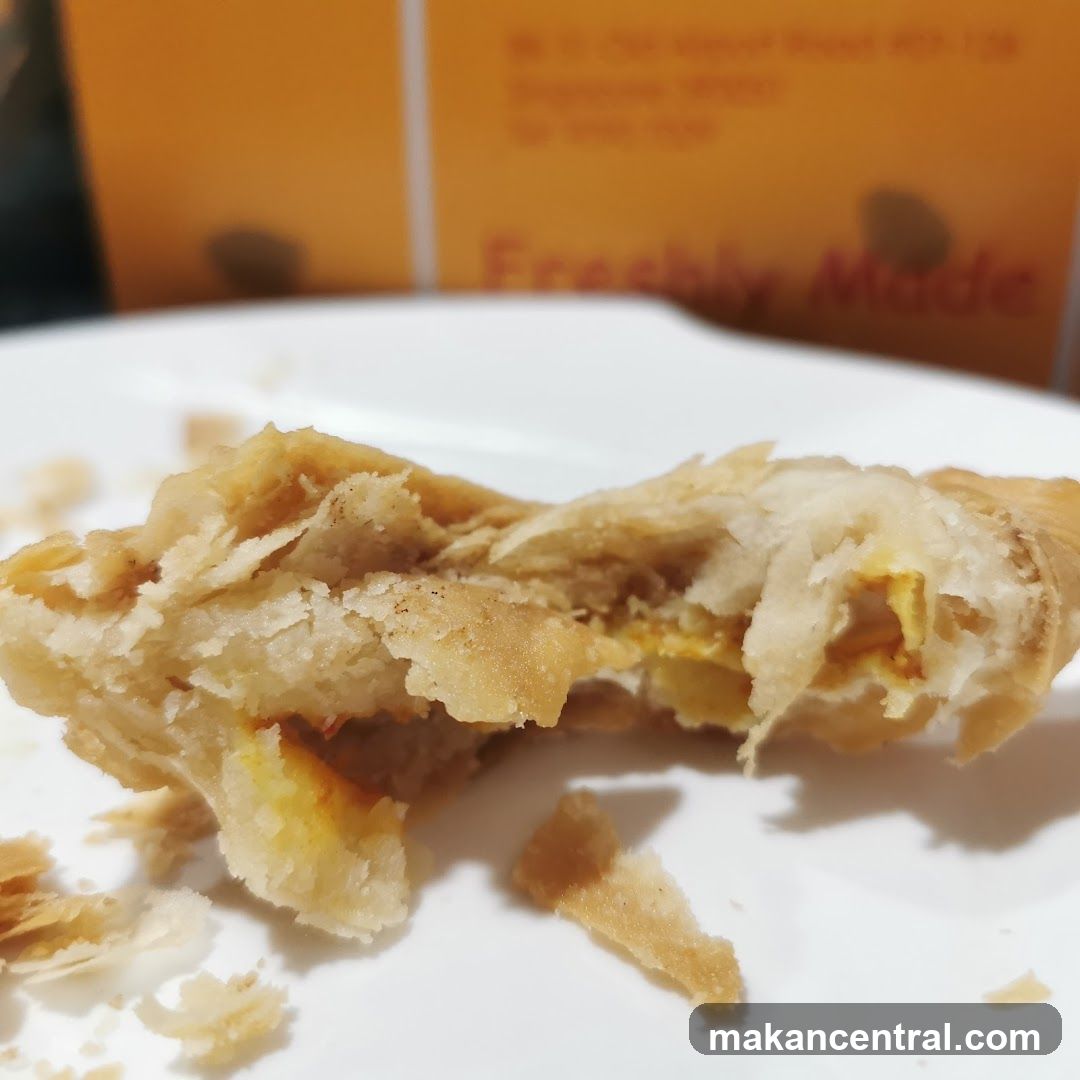 Close-up of a flaky pastry with filling