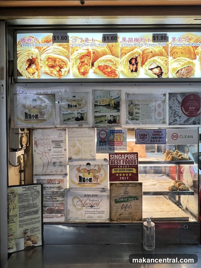 Food stall display with awards and menu items
