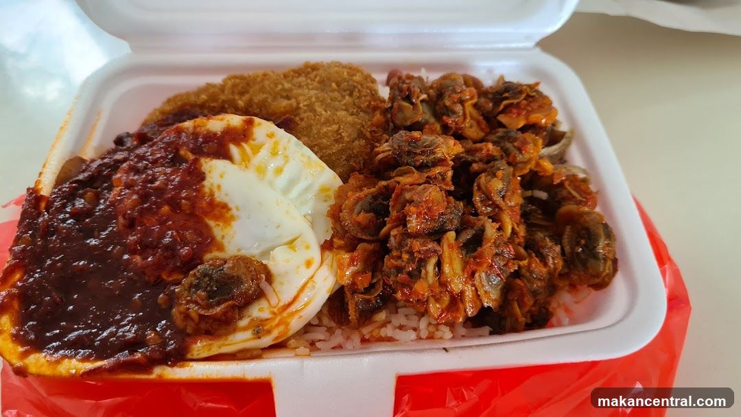 Rice dish with fried item and shellfish