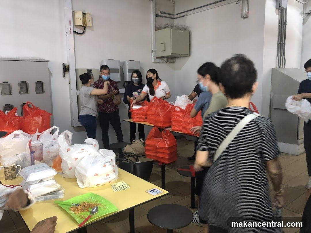 Volunteers distributing food bags