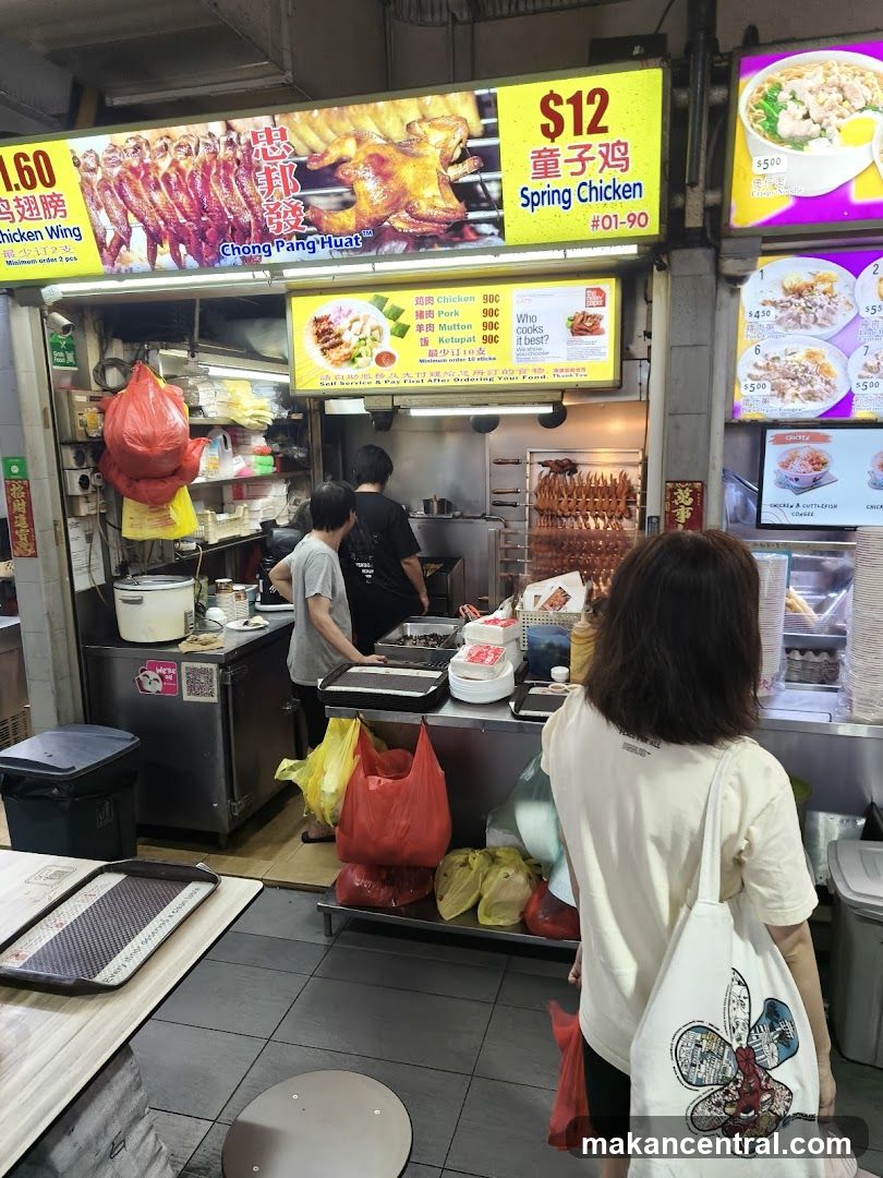 Food Stall with Roasted Chicken and Other Dishes