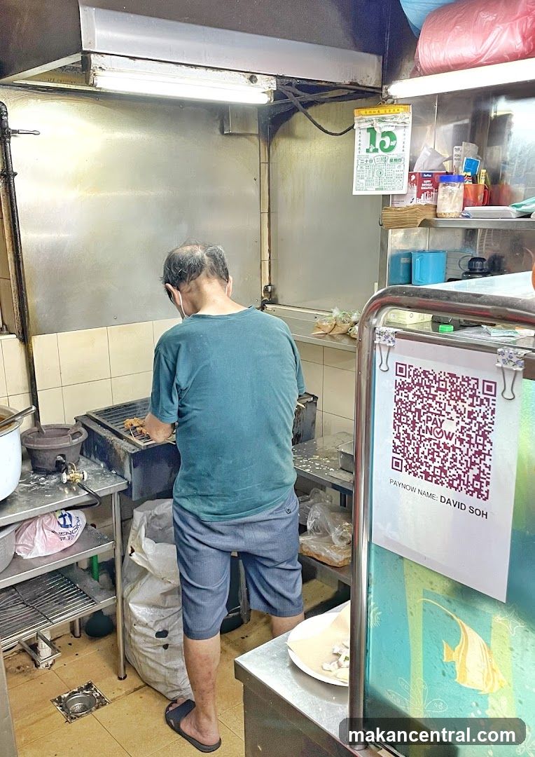 Man cooking skewers