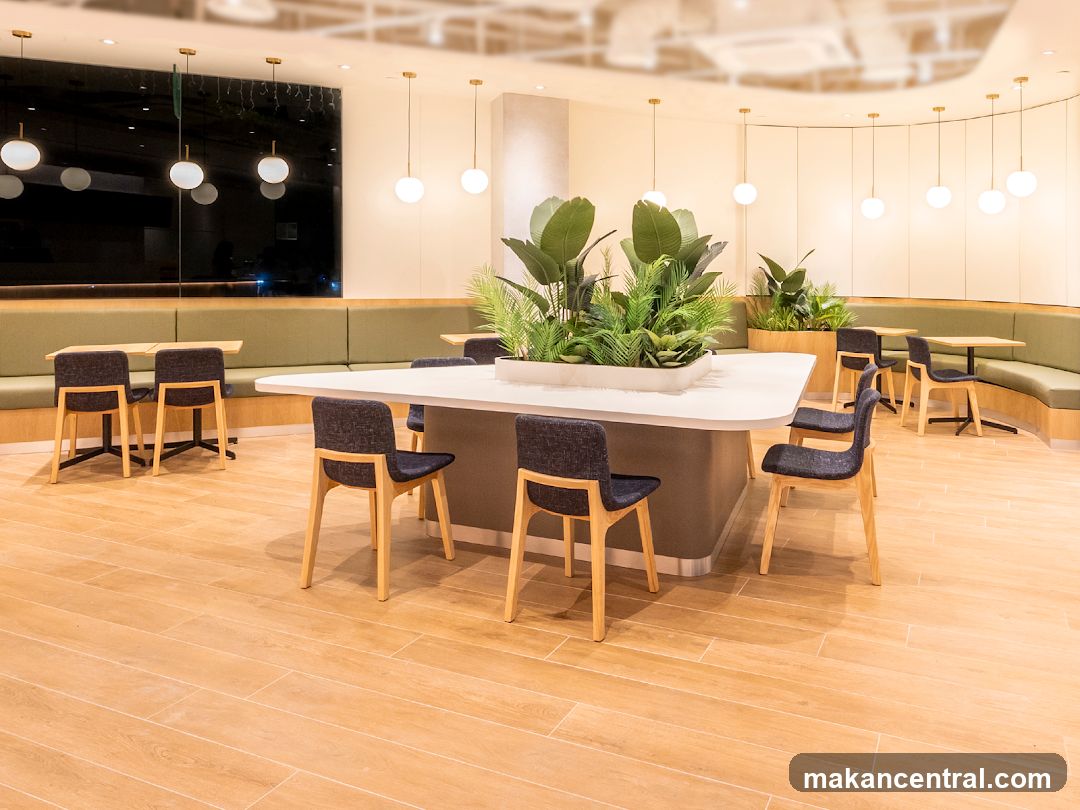 Modern Cafe Interior with Green Booth Seating and Plants