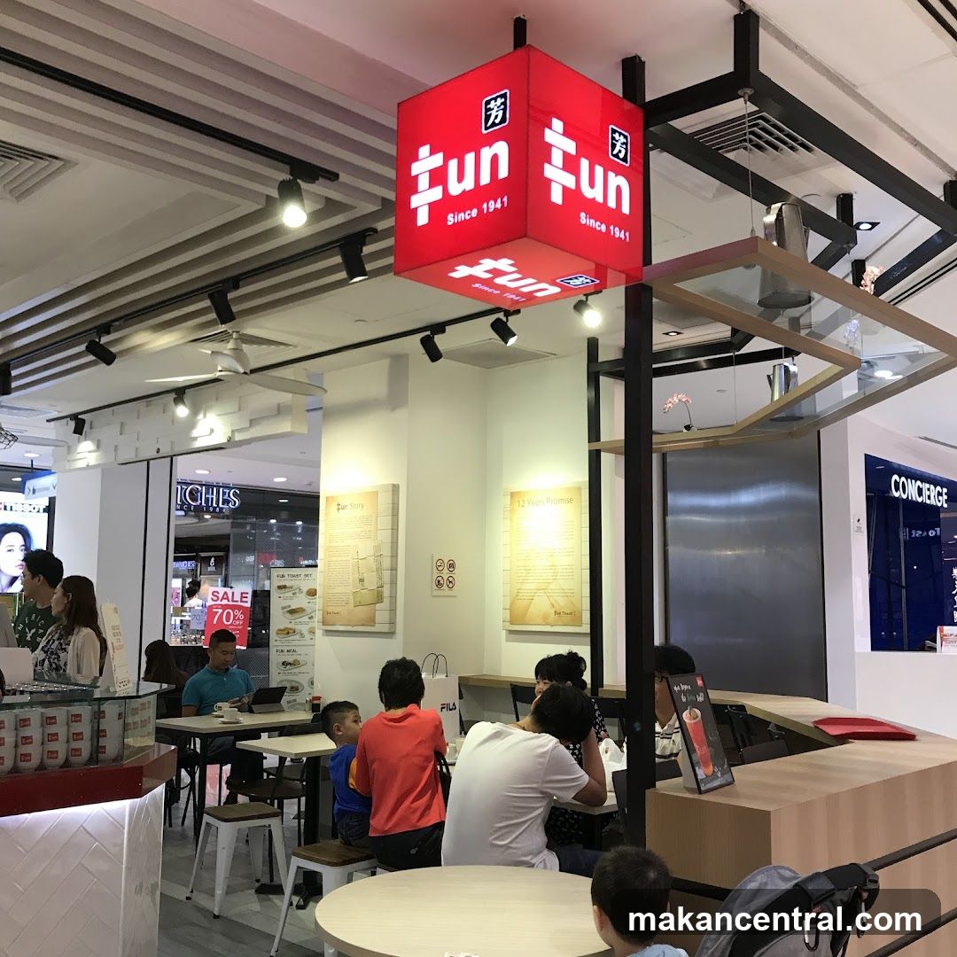 Interior of a cafe with a prominent red sign