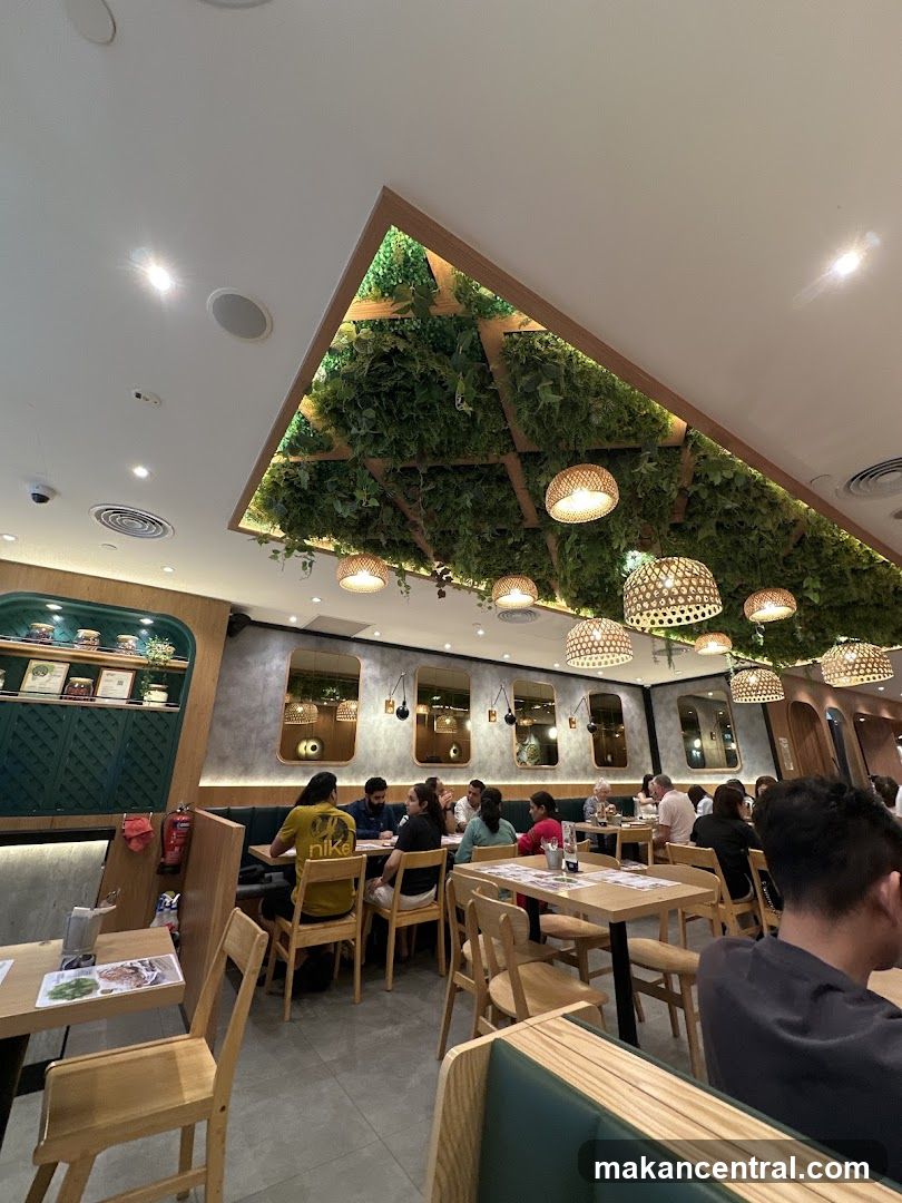 Restaurant Interior with Greenery and Woven Lamps