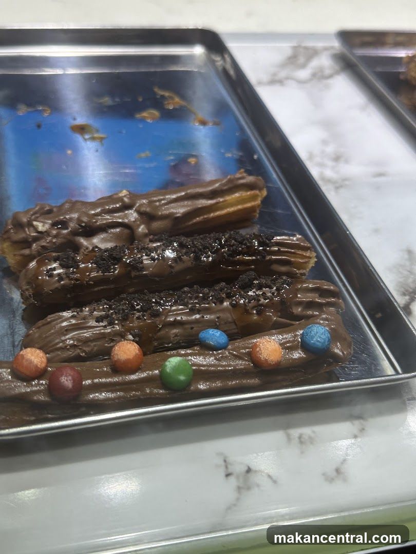Churros with chocolate and candy