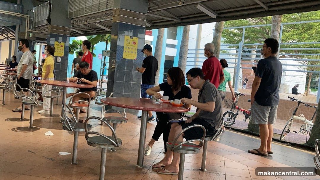 People dining at an outdoor food court