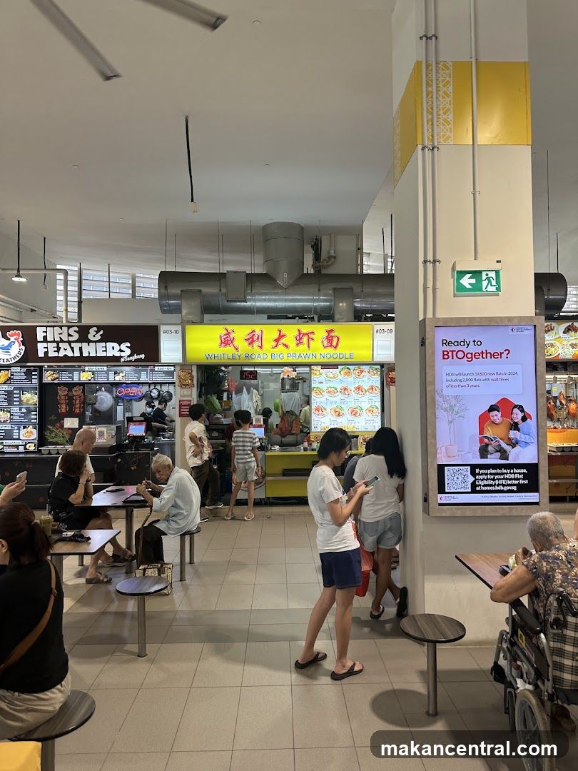 Food court with various stalls and patrons