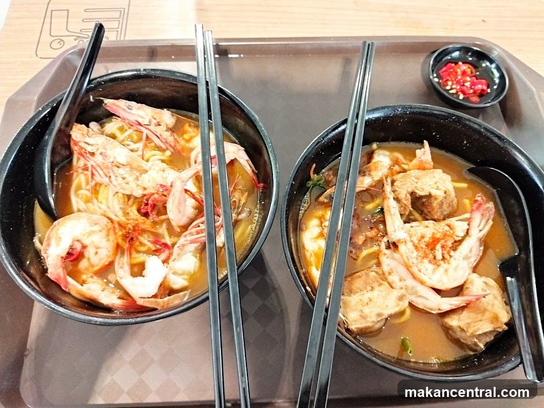 Two bowls of prawn noodle soup