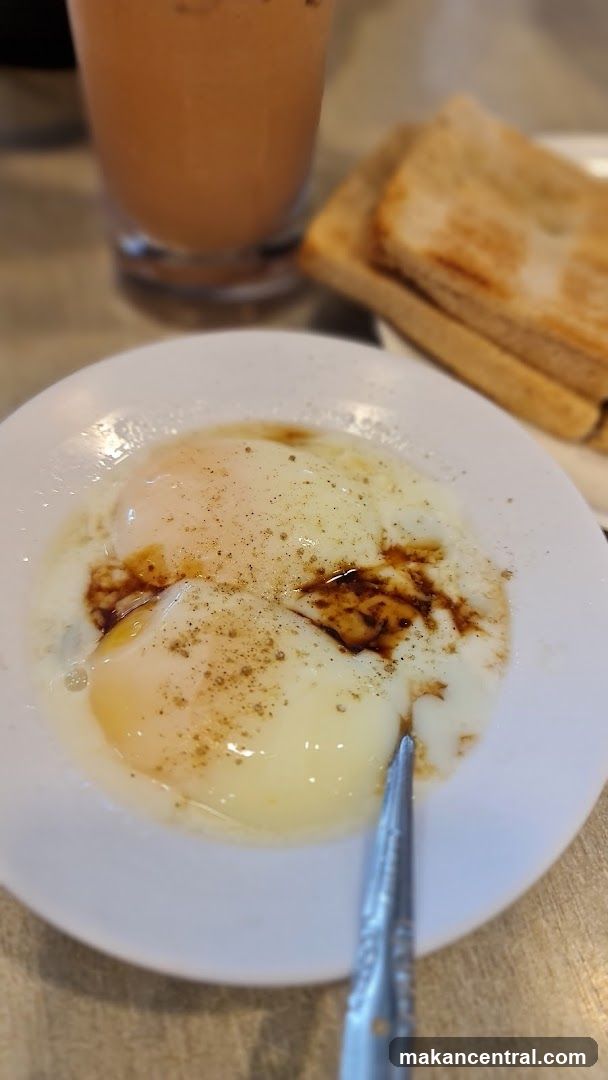 Soft-boiled eggs with toast and drink