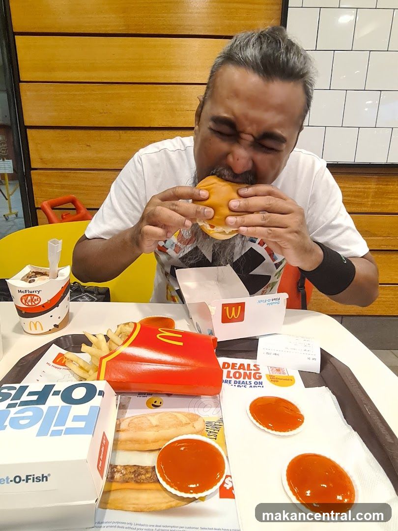 Man eating a burger at McDonald's