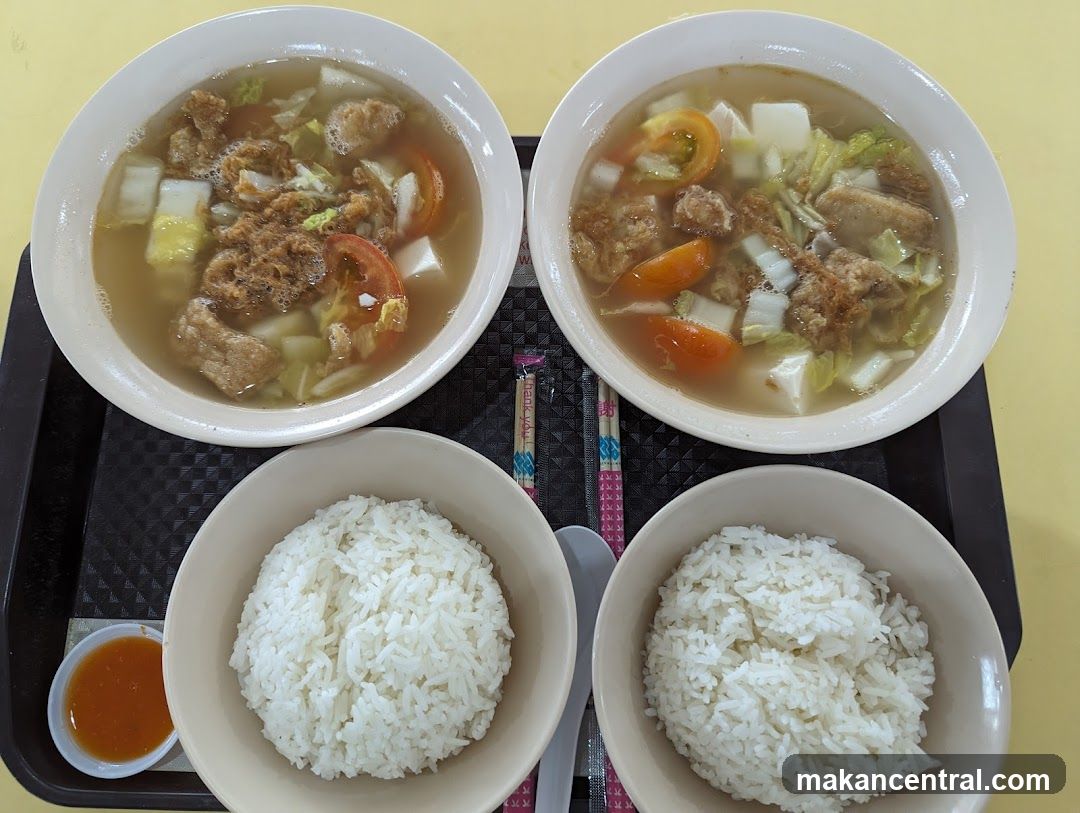 Two bowls of soup with rice