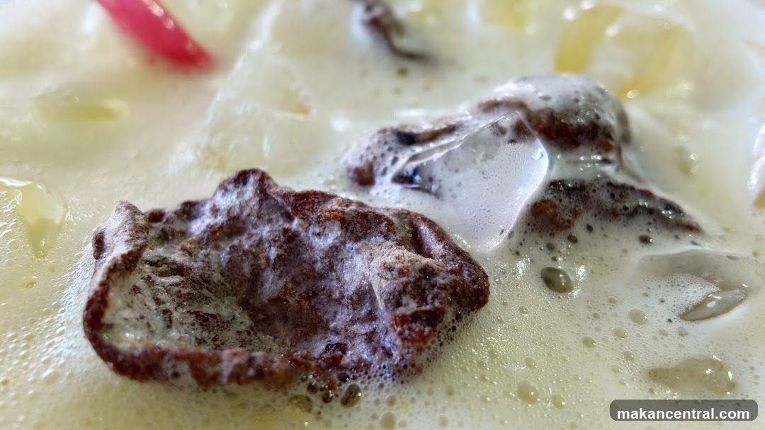 Close-up of a drink with ice and toppings