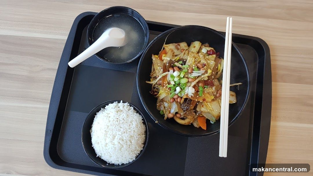 Spicy Noodle Dish with Rice and Soup