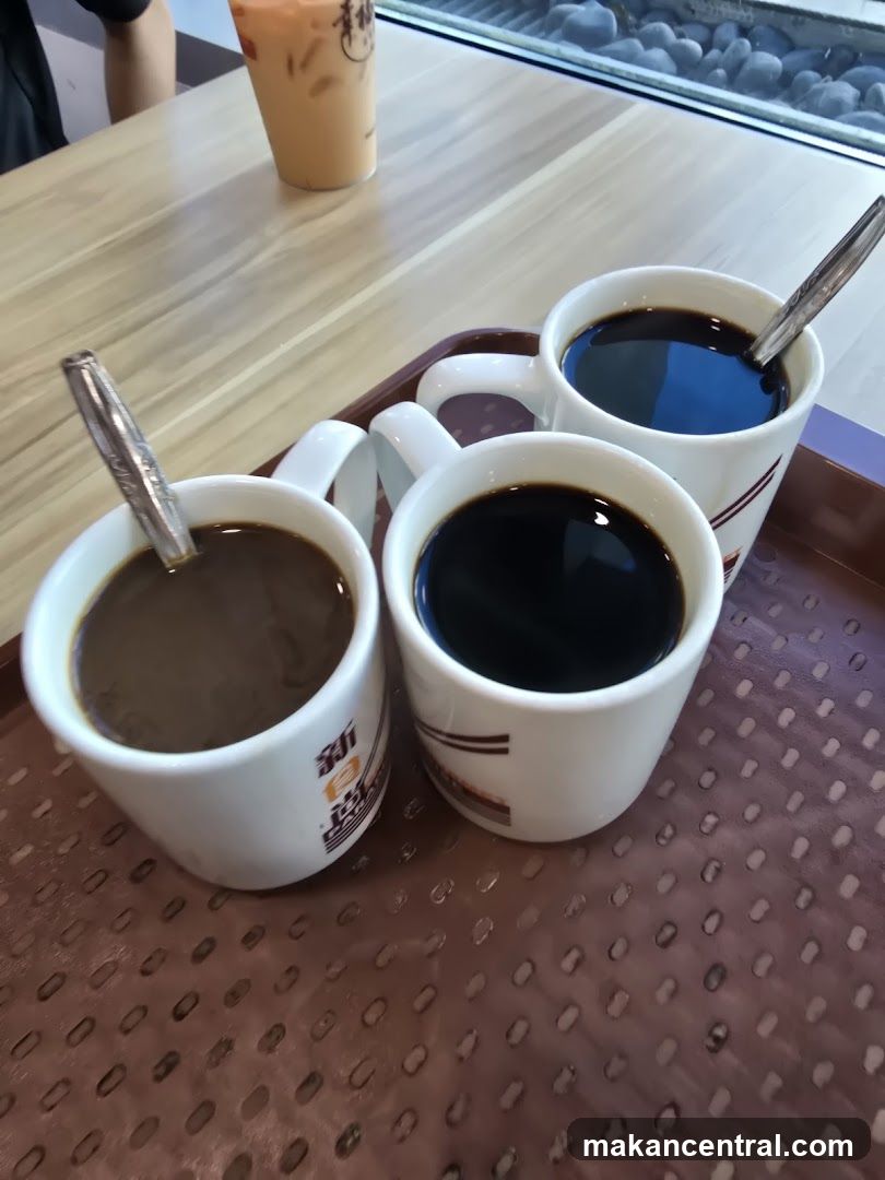 Three cups of coffee and a milk tea