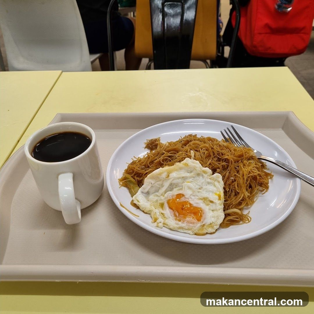 Fried noodles with egg and coffee