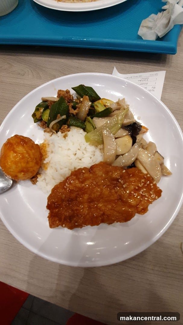 Plate of food with rice and various dishes