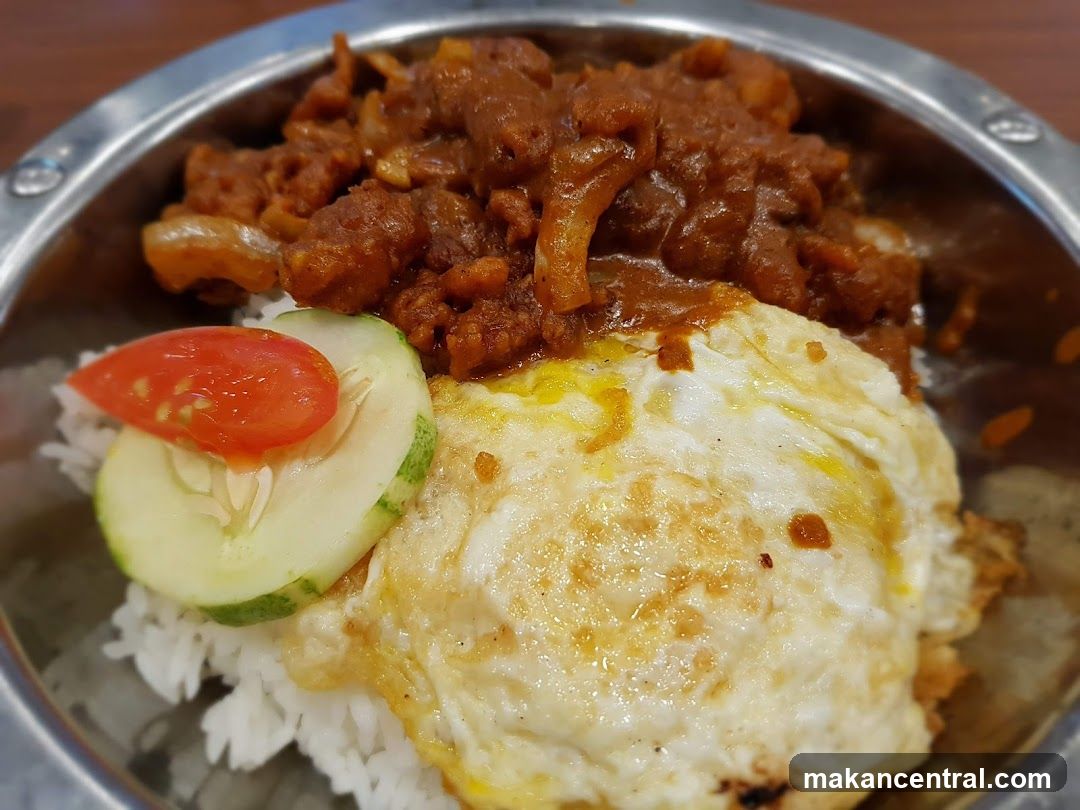 Rice dish with fried egg and curry