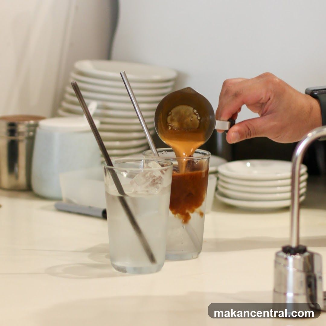 Pouring Coffee into Iced Drink